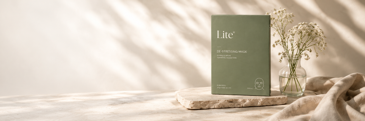 Lite De-Stressing Mask with flowers on a stone display